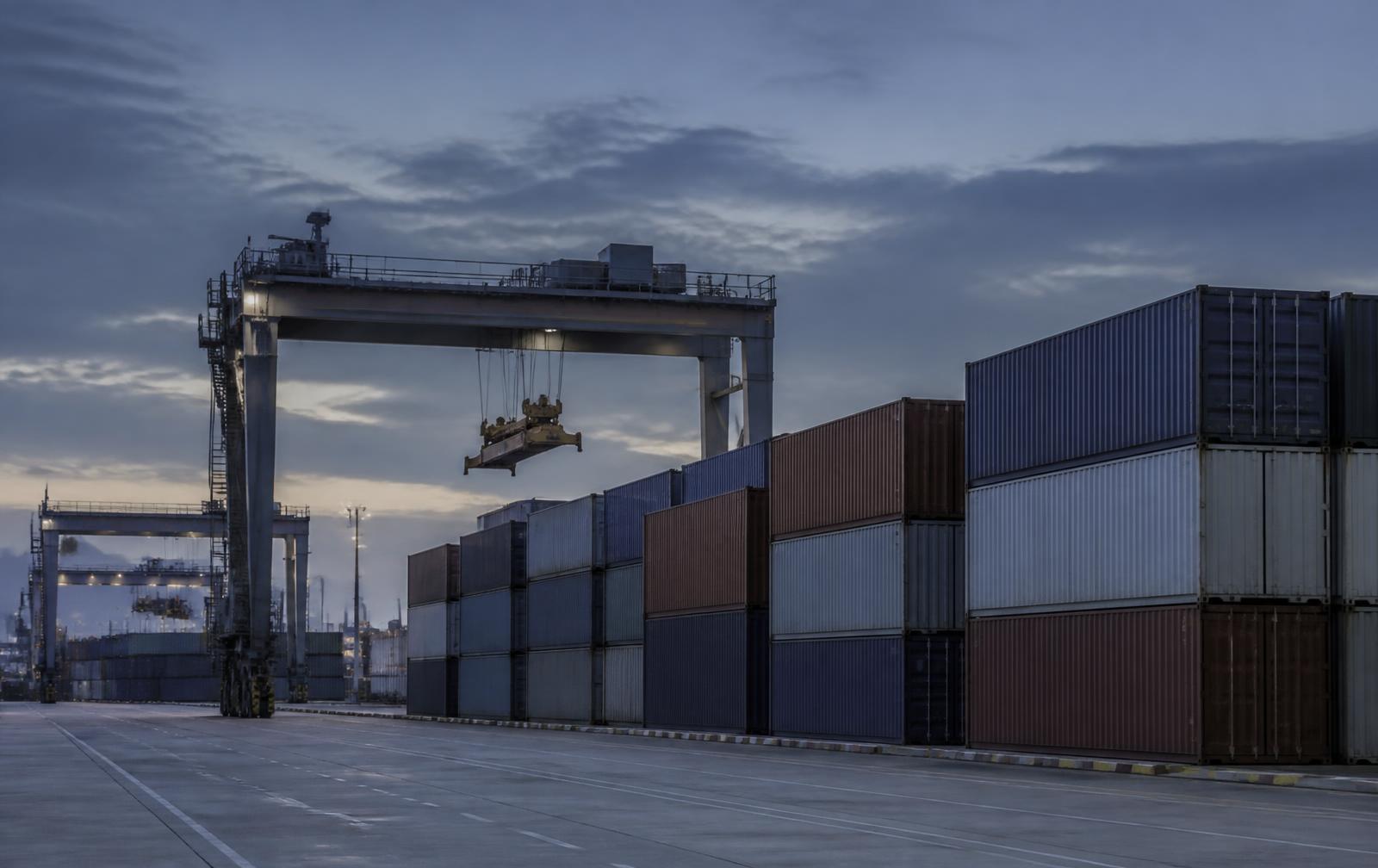 Container terminal at dusk, representing international trade and market access work